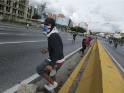 La oposición mantiene sus protestas; las marchas que han dejado 29 muertos, unos 500 heridos y más de mil detenidos. AP / F. Llano