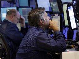 El Dow Jones se coloca, por ahora, en 21 mil 009.74 unidades. AP / ARCHIVO