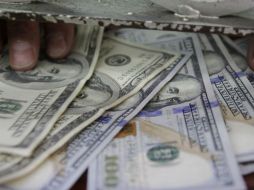 Analistas financieros estiman que el tipo de cambio se cotice entre 18.60 y 18.67 pesos por dólar. EL INFORMADOR / ARCHIVO