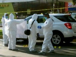 Se acordonó la escena del crimen donde fue ejecutado el mando policial. EFE /