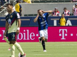 El 'Tito' celebra el primer gol de los Gallos, anotado desde los once pasos. MEXSPORT / V. Posadas
