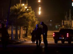 Los uniformados se percataron de la presencia de los vehículos estacionados, sin conductores a la vista. AP / ARCHIVO