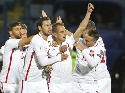 Con el festín de goles, Polonia queda como líder del Grupo E con 22 puntos. EFE/V. Bghdasaryan