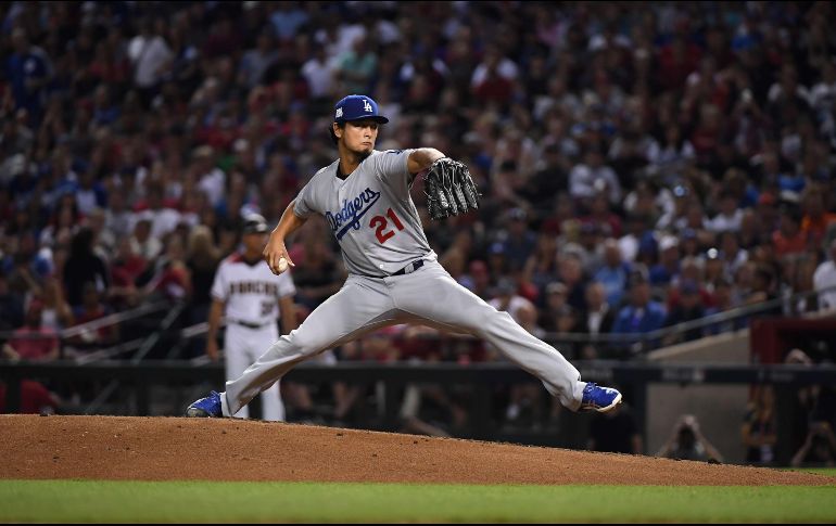 Yu Darvish ponchó a siete en cinco innings para superar a Zack Greinke, de Arizona, y conseguir la primera victoria en postemporada. AFP/N. Hall