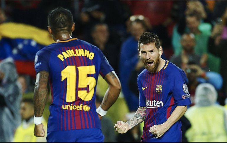 El argentino (D) necesitó 21 partidos menos que Cristiano Ronaldo para llegar al centenar de goles europeos. EFE/ A. García