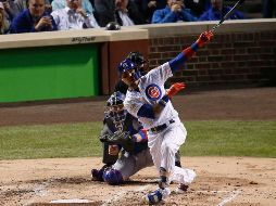 El puertorriqueño Javier Báez pegó un par de jonrones frente a Alex Wood, abridor de los Dodgers que cargó con la derrota. AP/C. Arbogast