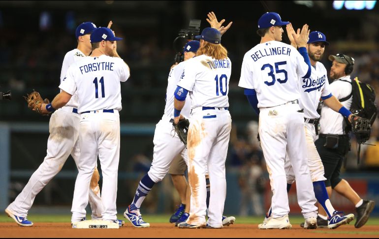 Los Dodgers ganaron con el soberbio pitcheo del zurdo Clayton Kershaw y jonrones de Justin Turner y Chris Taylor. AFP / S. Haffey