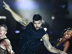 Con un escenario impresionante de luces y pantallas gigantes, el boricua logró una verdadera fiesta sonora. AFP/R. Schemidt