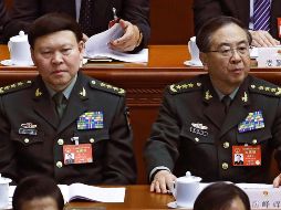 Zhang (i), director del departamento de trabajo político y miembro de la Comisión Militar Central, había caído en desgracia dentro del Partido Comunista de China. AP/A. Wong