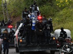 El gobierno de Hernández impuso un toque de queda de 10 días entre las 18:00 horas a las 06:00 de la mañana para sofocar las manifestaciones. AFP / J. Ordonez
