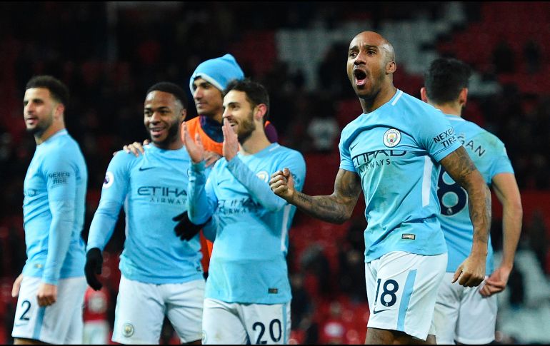 Los jugadores del City celebran al final del partido. AFP/O. Scarff