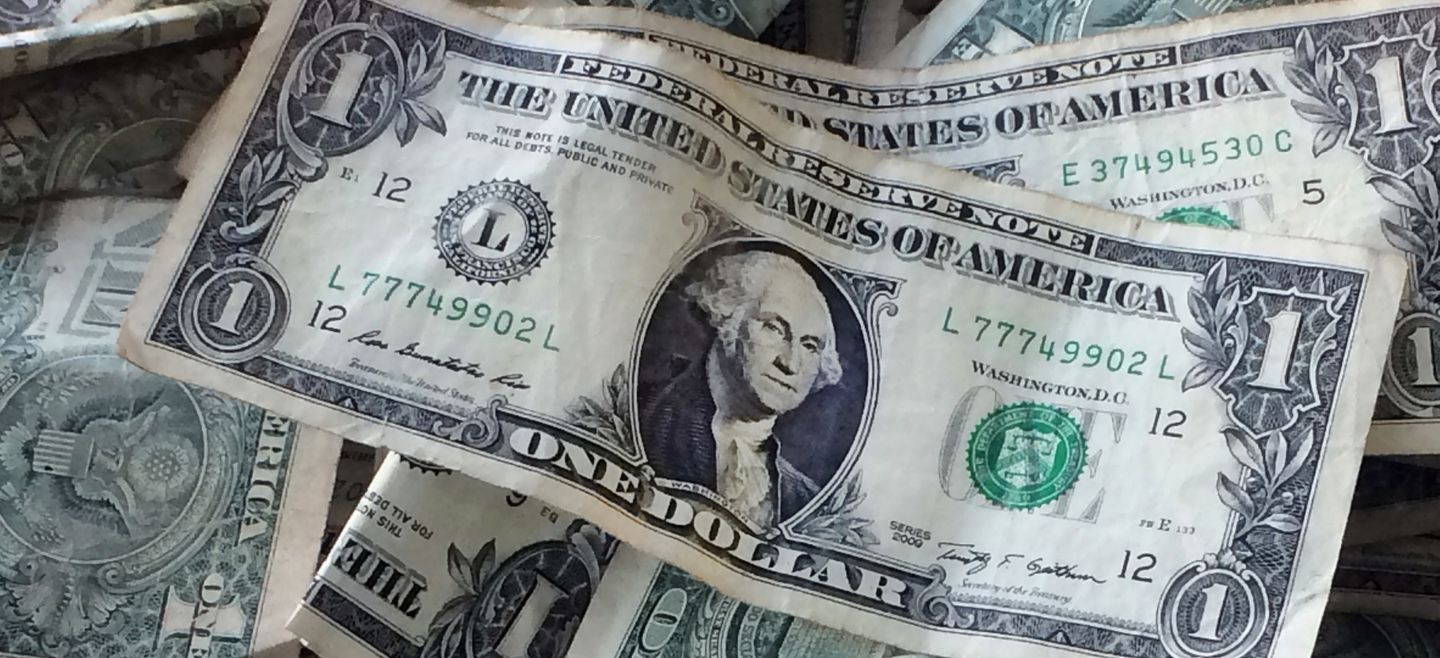 FILE - This Oct. - FILE - This Oct. 24, 2016, file photo shows dollar bills in New York. Ian Shepherdson, chief economist at Pantheon Macroeconomics, said that the tight labor market is expected to remain tight in 2018. That means companies will be hard pressed to find and retain workers, and in turn, will likely raise pay. (AP Photo/Mark Lennihan, File) Your Finances-Q A - OCT. 24, 2016, FILE PHOTO