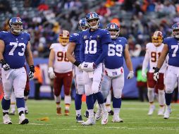 Manning (#10) completó 10 de 28 pases para 132 yardas con un pase de touchdown y una interceptación. AFP/A. Parr