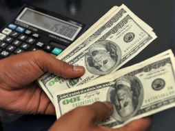 El Banxico fijó en 18.7148 pesos el tipo de cambio para solventar obligaciones denominadas en moneda extranjera. AFP / ARCHIVO