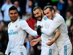 El encuentro quedó sentenciado en el primer minuto de la reanudación, cuando Benzema dio el pase de gol a Bale, que definió en carrera de zurda. AFP / P. P. Marcou