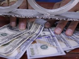 La divisa se compra en un precio mínimo de 17.31 pesos. EL INFORMADOR / ARCHIVO