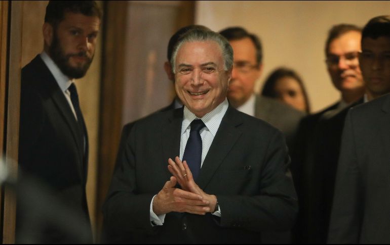 Las autoridades investigan si el decreto sancionado por Temer en 2017 y que alteró la ley de puertos, benefició a las empresas del sector. AFP / ARCHIVO