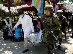 Por tal suceso, soldados y policías detuvieron a dos presuntos agresores. AFP / F. Robles