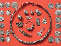 Parts of the silver treasure are pictured on a table in Schaprode - Parts of the silver treasure are pictured on a table in Schaprode, northern Germany on April 13, 2018. A 13-year-old boy and a hobby archaeologist have unearthed a