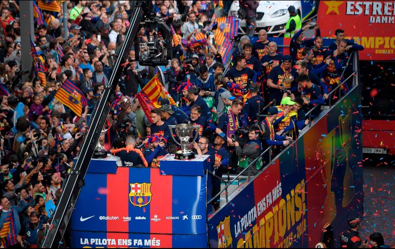 El habitual desfile de celebración por el centro de la ciudad catalana fue menos multitudinario y eufórico que en años anteriores. AFP / L. Gene