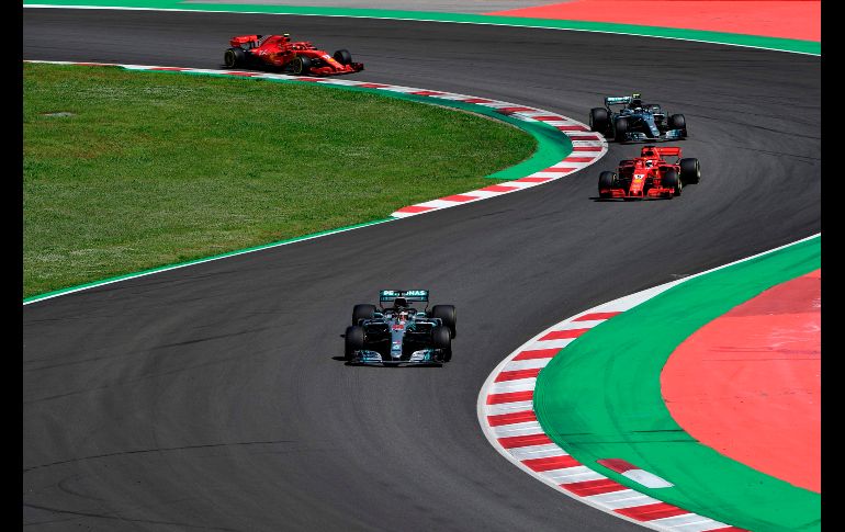 Su rival alemán Sebastian Vettel terminó en cuarta posición, tras una mala elección estratégica de su equipo. AFP / P. Marcou