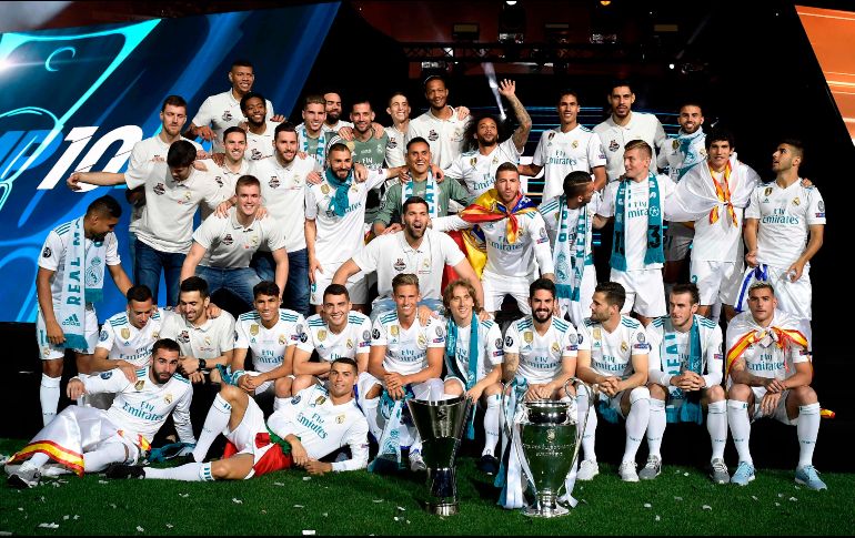 Miles de personas quisieron ver a sus ídolos con el trofeo de la Liga de Campeones bajo el brazo. AFP/O. del Pozo