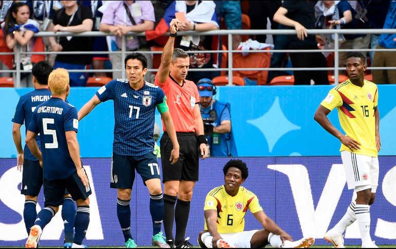 En el tercer minuto de partido, Carlos Sánchez vio la primera roja de la Copa del Mundo, en una jugada sancionada además con un penal que Shinji Kagawa transformó en gol. AFP / F. Monteforte