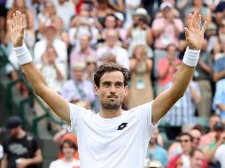 En un partido que dura dos días debido a la lluvia, el argentino da la vuelta al marcador y logra ganarle al croata y pasar a octavos. EFE / S. Dempsey