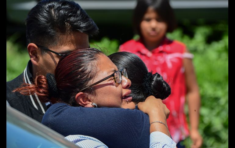 Mujeres reaccionan tras las explosiones. AFP/P. Pardo