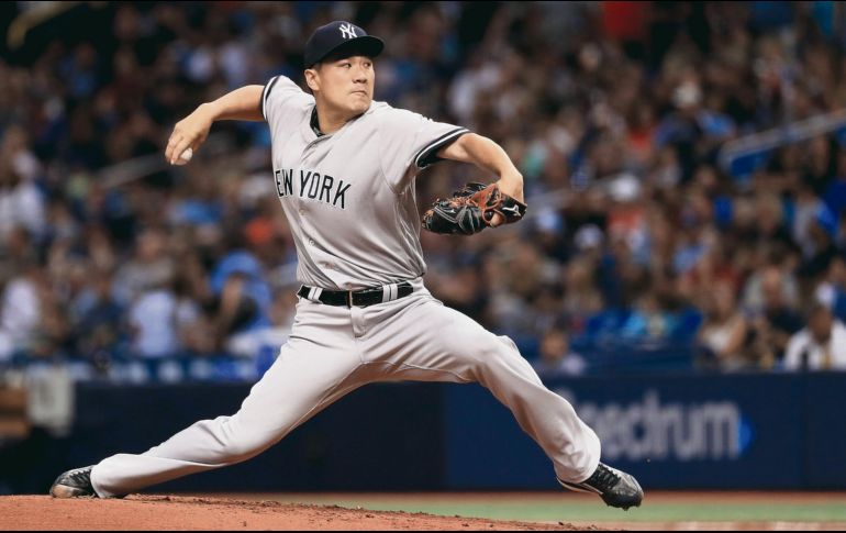 Masahiro Tanaka. El lanzador japonés tuvo una destacada labor ayer al permitir sólo tres imparables durante nueve entradas. AFP