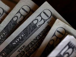 El Banco BASE prevé que el tipo de cambio cotice entre18.65 y 18.90 pesos por dólar en cotizaciones interbancarias a la venta. AFP / ARCHIVO