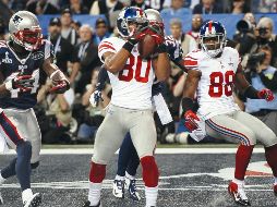 Víctor Cruz (#80) colaboró con una anotación en el Super Bowl XLVI ante los Patriots. AFP/T. Clary
