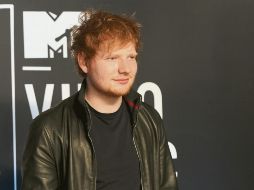 El intérprete sorprendió al público al anunciar que ya fue su boda. AFP