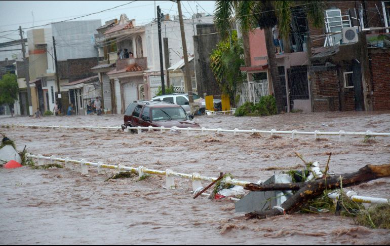 Las tres mujeres desaparecieron en el caudal del arroyo que desemboca en uno de los brazos de Río Humaya, en donde se espera que buzos inicien su búsqueda. EFE/ J. Cruz