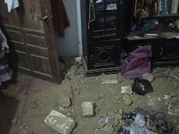 Destrozos causados en una vivienda luego del temblor. AFP/CORTESÍA