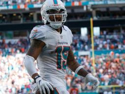 Wilson destacó al atrapar seis pases para 155 yardas y dos anotaciones aéreas, en la victoria de Miami sobre Chicago en tiempo extra. TWITTER / @NFL