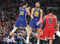 Histórico. Klay Thompson (#11) embocó 14 triples ayer frente a los Bulls. AP / K. Krzaczynski