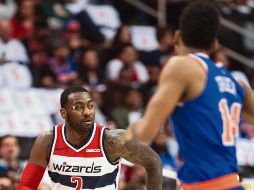 John Wall volvió a ser el mejor jugador de los Wizards en su segunda victoria de la campaña. AP