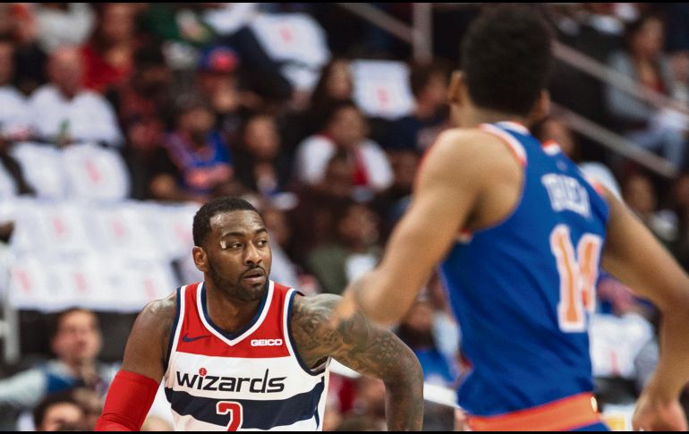 John Wall volvió a ser el mejor jugador de los Wizards en su segunda victoria de la campaña. AP