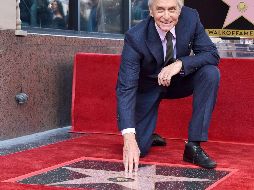 El actor posa con su estrella, en medio de un clima jovial. AFP/G. DeGuire