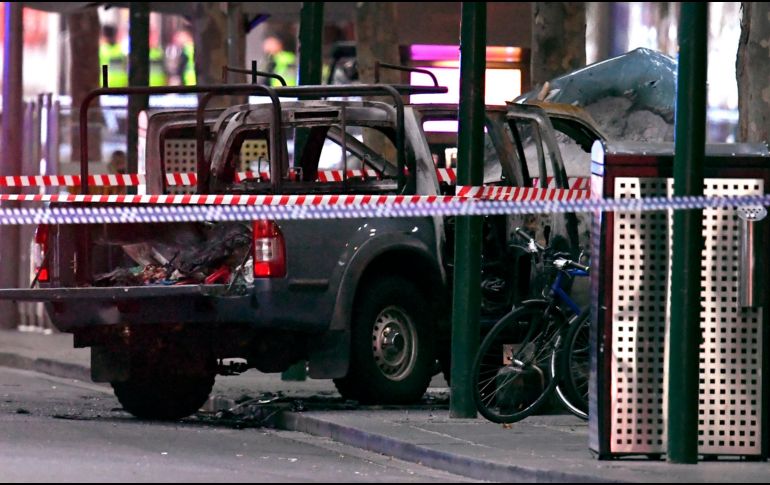 El lugar del incidente quedó acordonado por los artificieros para asegurar el área comercial de la calle Bourke. AFP / W. West