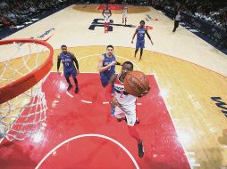 John Wall (#2) fue el líder anotador de los Wizards con 25 puntos. AFP / N. DISHMAN