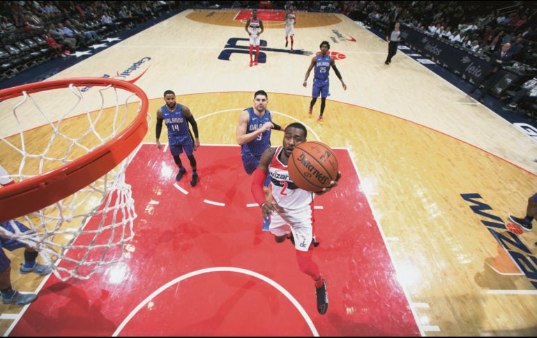 John Wall (#2) fue el líder anotador de los Wizards con 25 puntos. AFP / N. DISHMAN
