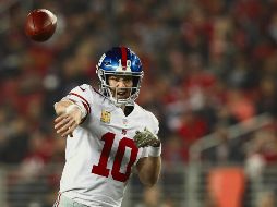 Eli Manning tuvo una de sus mejores actuaciones del año al lanzar tres pases de anotación. afp / E. Shaw