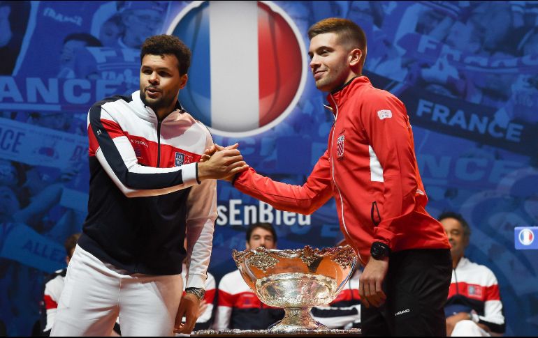 El francés Jo-Wilfried Tsonga (izquierda) y el croata Borna Coric protagonizarán uno de los duelos de singles de la Final de la Copa Davis. AFP/P. Huguen