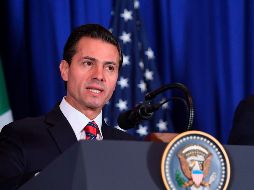 La mañana de este viernes, Enrique Peña Nieto firmó, junto a sus homólogos canadiense y estadounidense, el T-MEC. AFP / S. Loeb