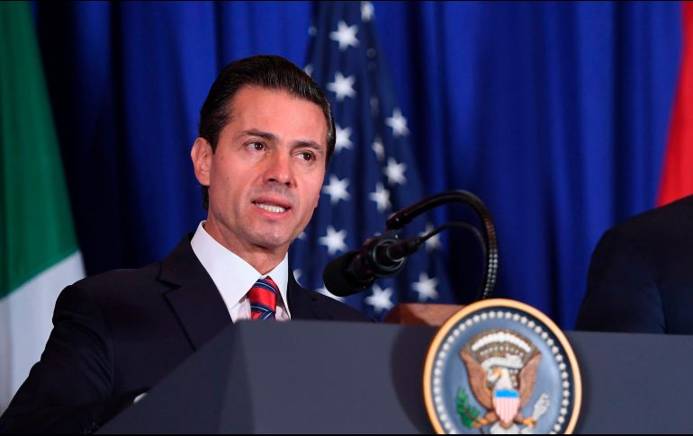 La mañana de este viernes, Enrique Peña Nieto firmó, junto a sus homólogos canadiense y estadounidense, el T-MEC. AFP / S. Loeb