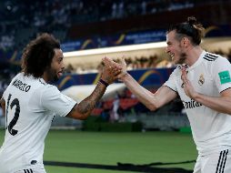 Bale (D) celebra con Marcelo (I) tras anotar su primer gol del partido. AP/H. Ammar