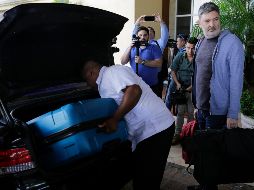 Miembros de la misión especial de la Comisión Interamericana de Derechos Humanos abandonan el hotel donde se hospedaban, tras el anuncio de expulsión. AFP/I. Ocon