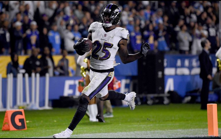 Tavon Young regresó un balón suelto hasta las diagonales en el último cuarto, asegurando el triunfo de Baltimore. AFP/H. How